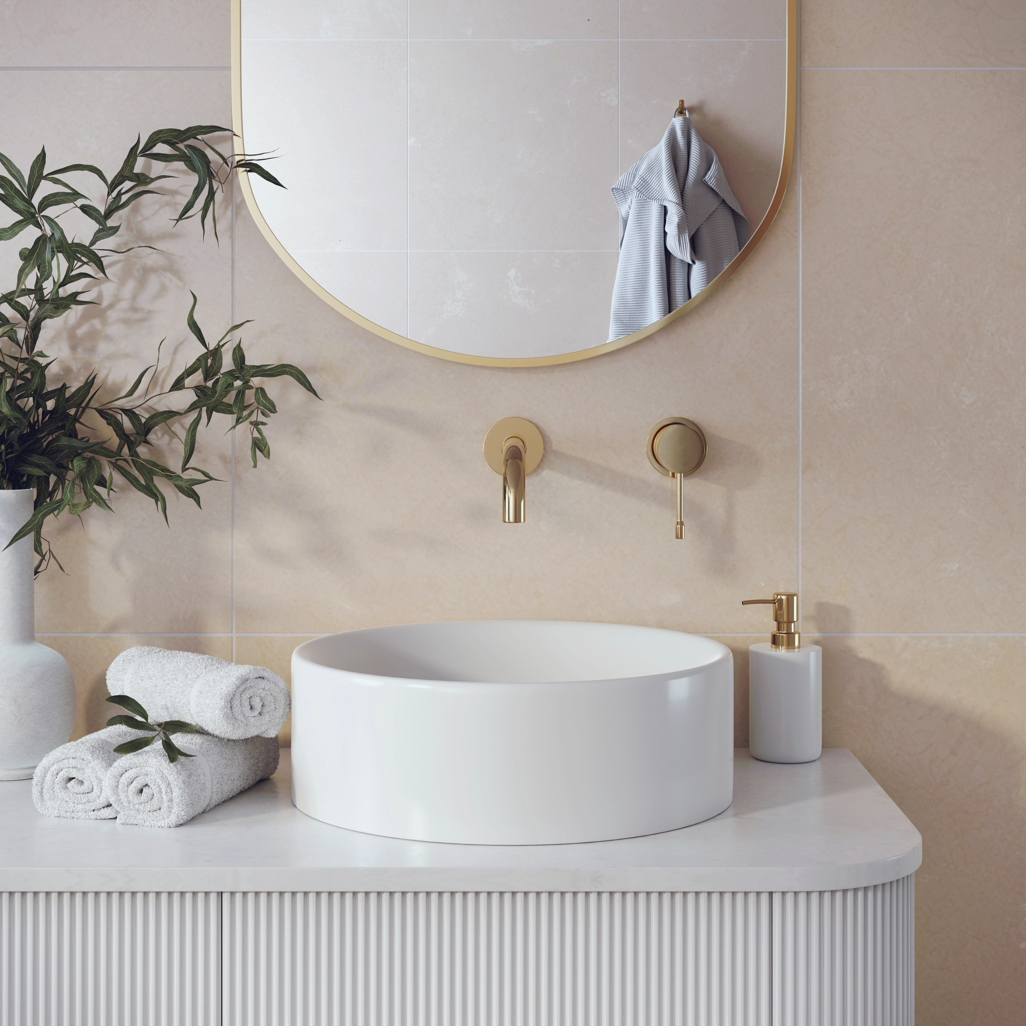 Round white basin on a fluted vanity with a brushed gold wall tap and an arched mirror